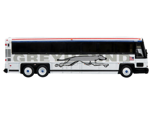 2001 MCI D4000 Coach Bus "Greyhound" White with Red and Blue Stripes "Vintage Bus & Motorcoach Collection" Limited Edition to 504 pieces Worldwide 1/87 (HO) Diecast Model by Iconic Replicas