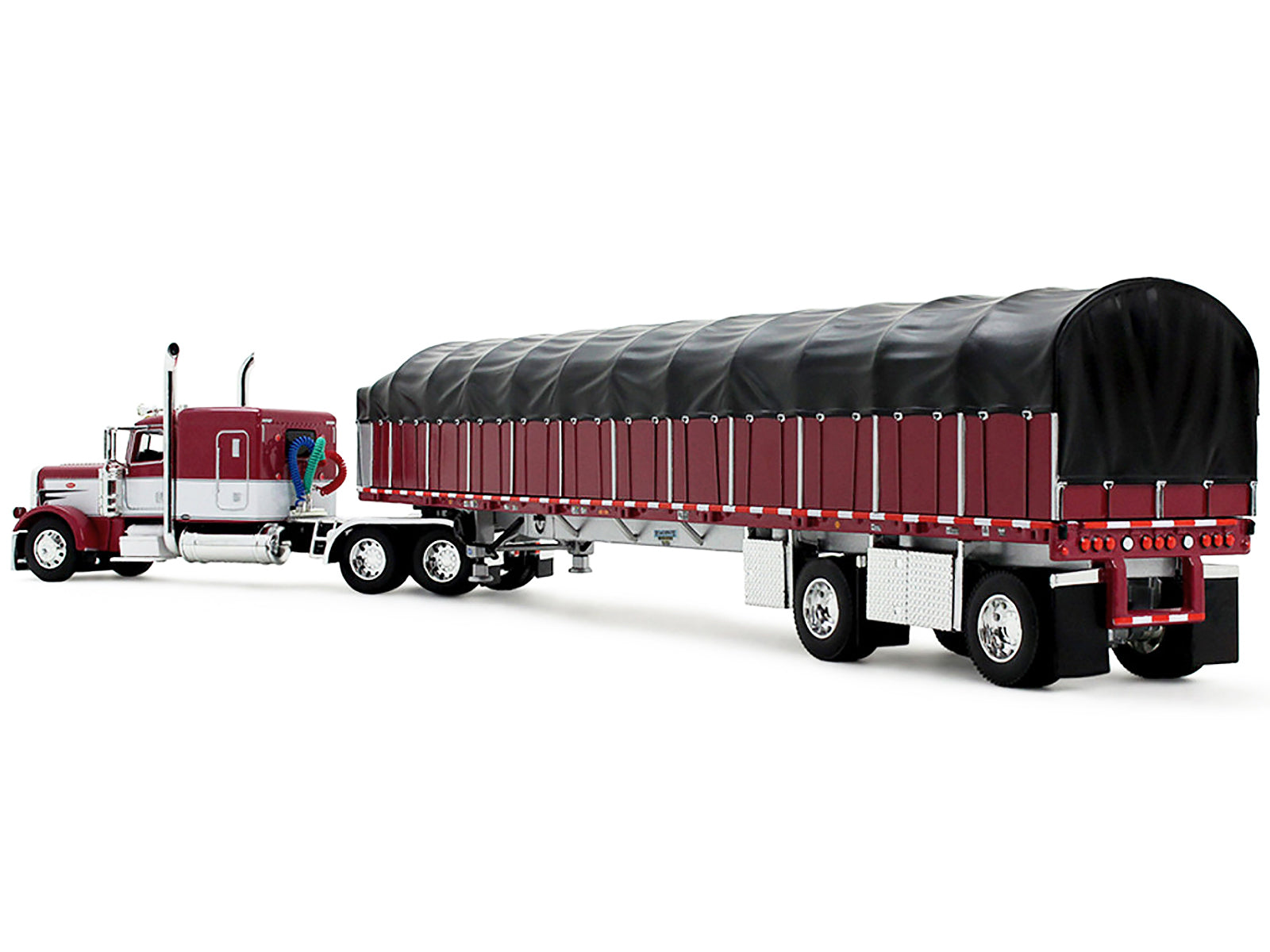 Peterbilt 389 with 63" Flat Top Sleeper and 53‚Äô Wilson Roadbrute Flatbed Trailer with Covered Wagon Maroon with White Stripes 1/64 Diecast Model by DCP/First Gear